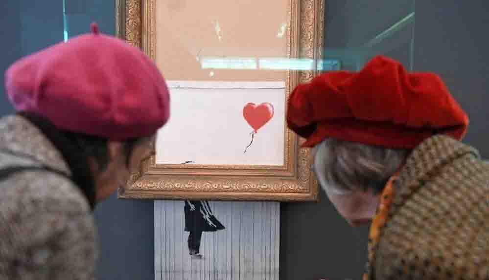Banksy'nin kendini doğrayan Balonlu Kız eseri açık artırmaya çıkıyor